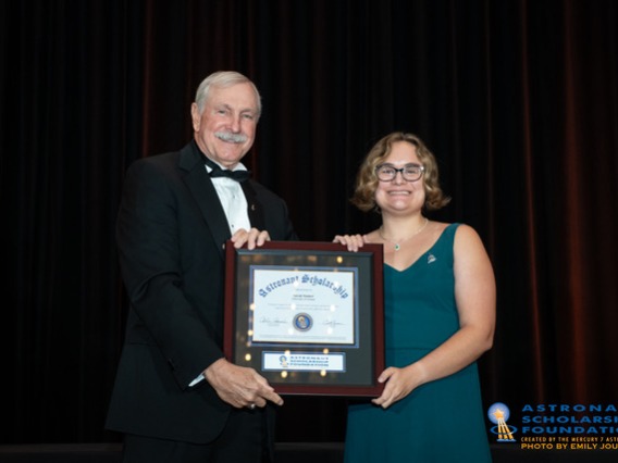 Astronaut Curt Brown presents the award to Sarah Stamer