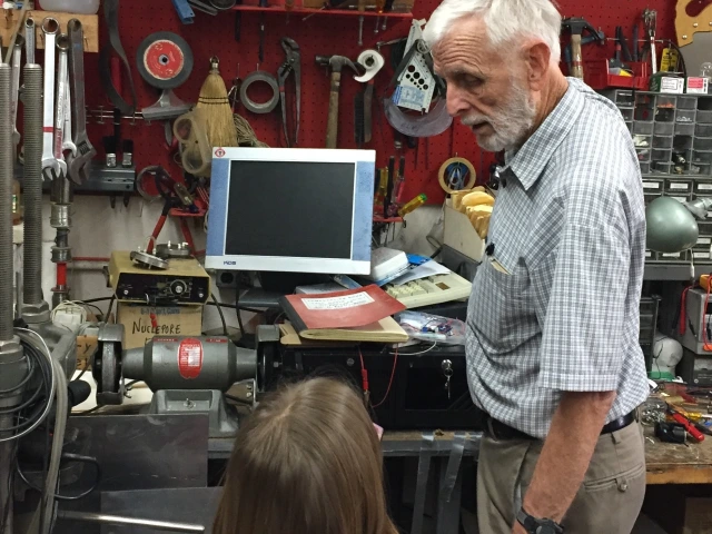 Donald Huffman in lab with child