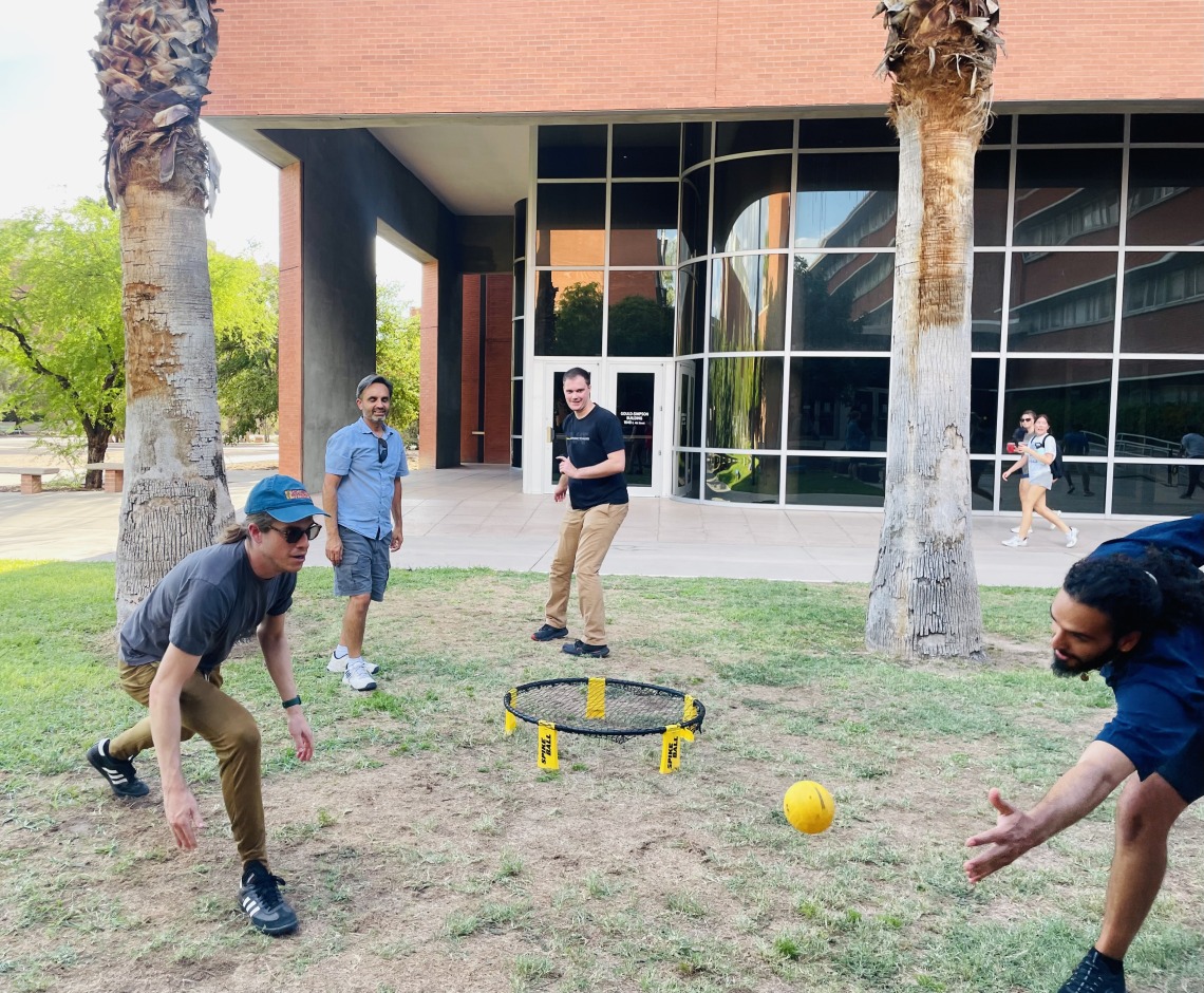 Playing Spikeball at the welcome event